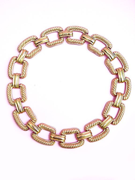 A knock out!

Simply stunning bold, gold collar by jewelry-master Givenchy. It has a feeling of a much older piece . . . like something from classical antiquity, a Greco-Roman collar.

Impeccable Givenchy quality . . . Each segment of the chain