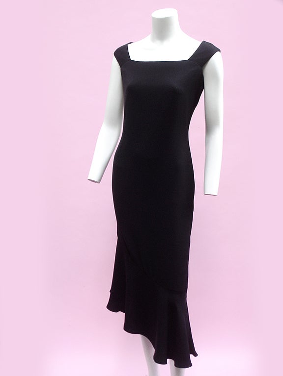 From late fashion icon Gianni Versace comes this elegant black silk dress. It has an expensive rich-chic look. If you need a dress that is classy yet sexy (something to wear to an important work event, for instance, or a birthday dinner for your