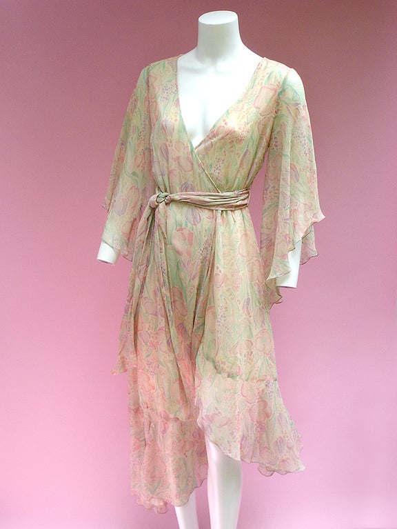 Delicate and ethereal wrap dress  . . . Cream silk chiffon in a delicate watercolor floral print . . . Botanical pastels . . . Colors are soft and muted . . . 

This is a true wrap dress with a matching silk sash belt . . . Has a floaty, bohemian