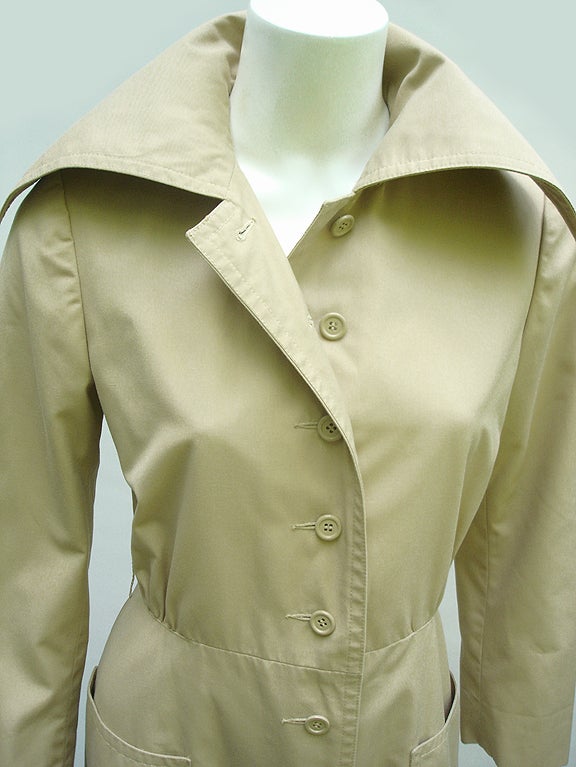 Everything A Girl Could Want In A Trench and MORE A Trench And REMOVABLE CAPE.

THIS COAT IS FANTASTIC- Such Timeless City-Chic And Elegant And Simple Design... Nice Neutral Tan Shade..... Love The Over Sized Dramatic Collar- And The Fabulous Line