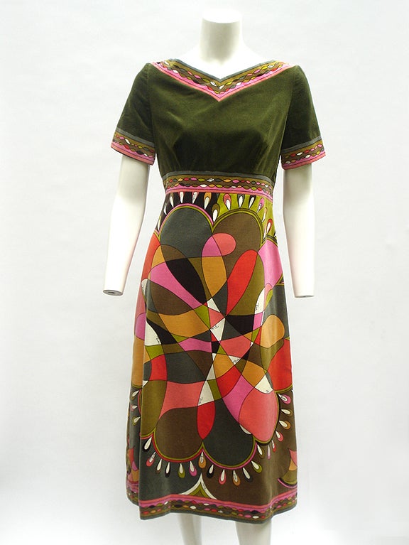Breathtaking.

Jaw dropping.

Gorgeous.

This is an iconic Pucci, one of highly desirable velvet dresses. They are among the rarest and the most valuable in Pucci's oeuvre. 

The main color is a rich olive. The print is a Pucci masterpiece