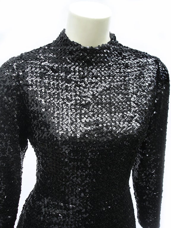 Fantastic Vintage Black Sequined 60s Mini Dress from Anne Fogarty...So Minimal is its Design- with the sleekest  Mock T -Neck--and a So Body Sculpted  Bodice- SO Cool in its Understated Covered-up Chic. Skirt portion is slight A-ine...Darted bust. 