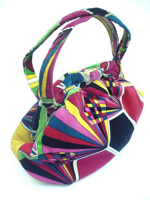 The most fantastic Pucci print...

Vintage 1960's Emilio Pucci Bags By Jana. Made In Italy. Beautiful Mod Print Handbag--Authentic. Excellent Condition. One inside zipper pocket, one inside open pocket, leather piping around body of bag in perfect