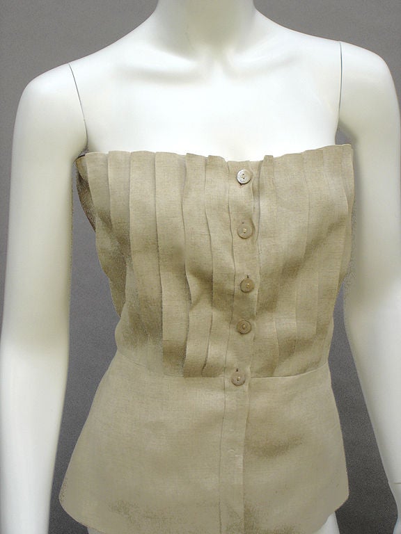 This Gucci corset top is outstanding for its modern vibe ... <br />
<br />
Crisp linen bustier with precision knife-pleats ... Double-sided ... Natural oatmeal color ... Mother-of-pearl double-G Gucci buttons are just beautiful ... Boned at sides