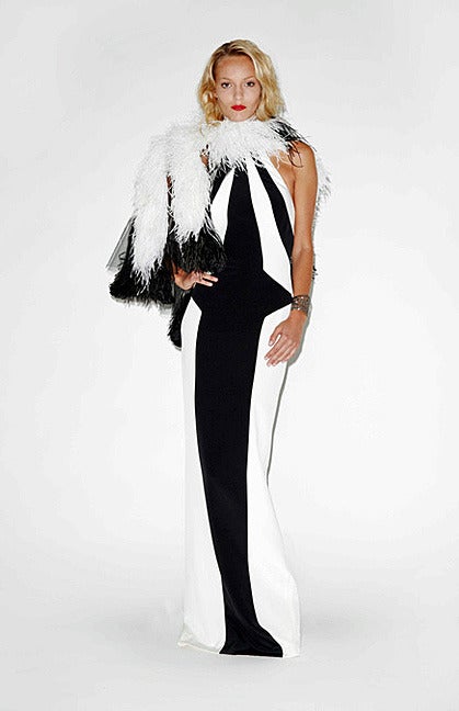 A bold entrance making creation by fashion designer L'Wren Scott (1967-2014). Known for her impeccable taste and style as well as for long slenderizing silhouettes, femininity and impeccable elegance.

A halter style black and white stretch silk