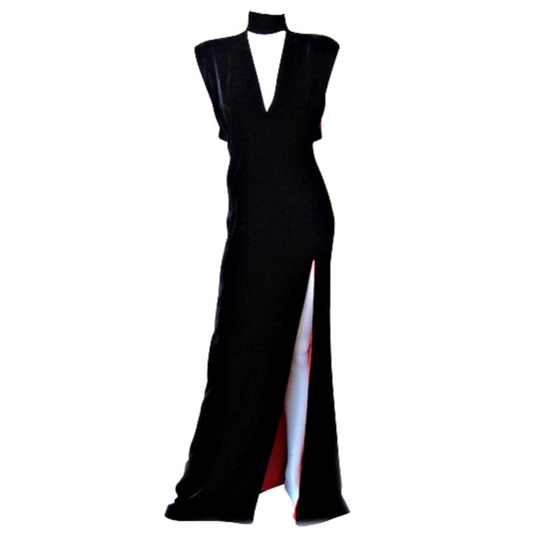 Vintage Thierry Mugler Couture black velvet bias cut gown with thigh high slit.   Fully lined in red silk charmeuse designed to show at arm openings and side leg slit.   Also features plunging neckline and high neckline snap closure.   Gown designed