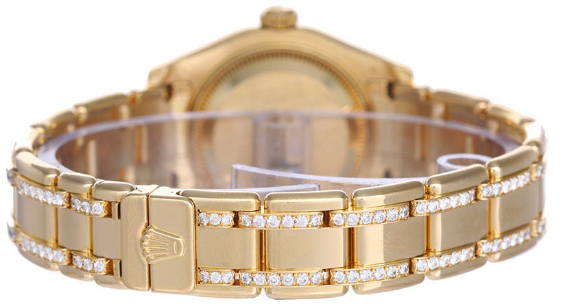 Automatic winding, 31 jewels, Quickset, sapphire crystal. 18k yellow gold Oyster style case with genuine Rolex diamond bezel (29mm diameter). Genuine Rolex Mother-of-Pearl dial with diamond hour markers. 18k yellow gold and diamond Pearlmaster 74948
