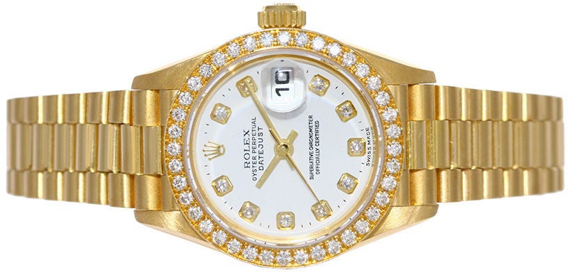 Rolex Ladies President Model 79178 automatic winding wristwatch with date. 18k yellow gold case with factory diamond bezel.  White dial with factory diamond markers.  18k yellow gold Rolex hidden clasp President bracelet. Pre-owned with Rolex box