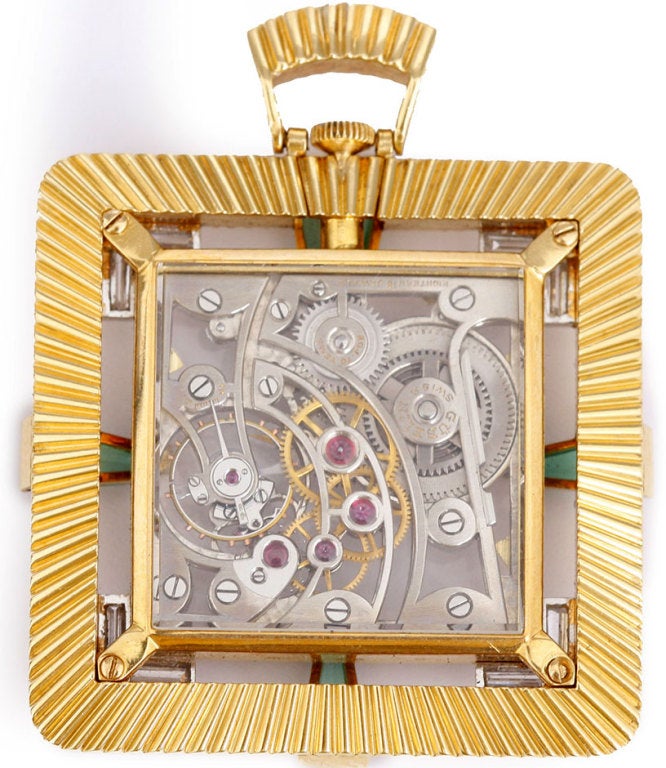 Manual winding. Yellow gold case, Art Deco style with exposition back. Bezel set with tourmalines on four sides, two baguette diamonds in each corner. Skeleton dial. Very unusual timepiece. Pre-owned.