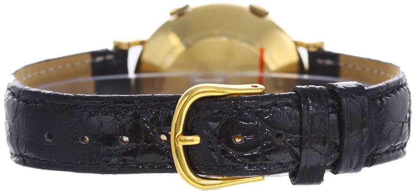 Men's Vintage Cartier Jaeger-LeCoultre Alarm Watch, 18k yellow gold case signed EWC with hand punched numbers on back. Silver dial with raised gold hour markers. Strap band. Very rare vintage alarm watch made by Jaeger-LeCoultre in the 1940's.