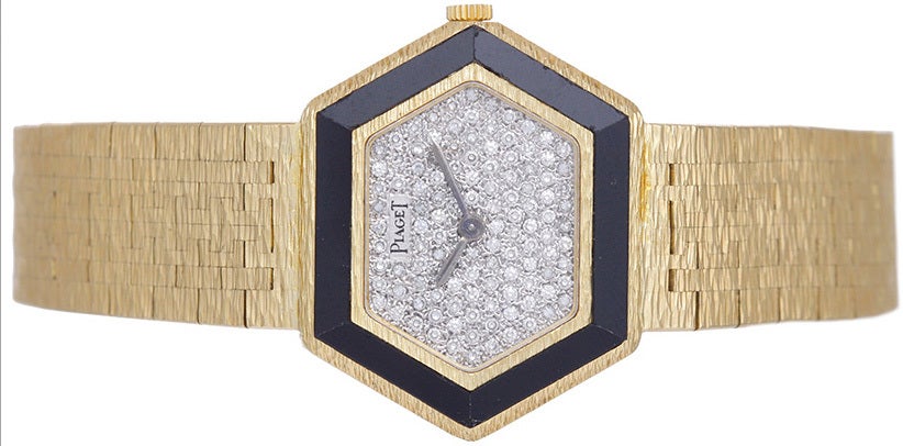 Piaget lady's 18k yellow gold bracelet watch with pave diamond dial and onyx bezel. Manual winding. Hexagonal case (29mm x 25mm) with 18k yellow gold integrated mesh bracelet (will fit apx. 6-1/2-inch wrist). Pre-owned with box.