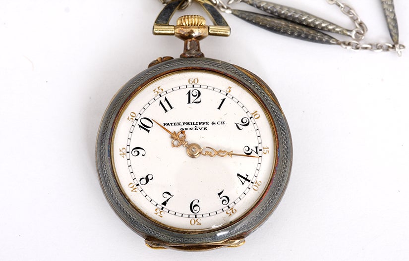 Very Rare Patek Philippe Lady's Gold Pendant Watch with Manual-Wind Movement. 18k yellow gold case with gray-blue enamel finish; intricate design. Case back features an oval art deco design with diamonds around mother and child image with aqua