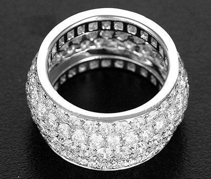 This amazing ring is similar to a famous designer's Nigeria Ring. It has a total diamond weight of apx. 6.0 carats of very white diamonds. It measures 1/2 inch wide and is a size 7- 7 1/2 apx. This ring is a show stopper and can be worn day or