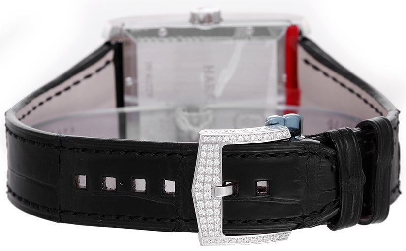 Harry Winston Avenue Squared A2 Dual Time wristwatch, 18k white gold and diamond, automatic movement. 18k white gold case with 10+ ct baguette diamond bezel (43mm x 44mm). Silvered dial with dual time, date, sun and stars, day/night indicators.