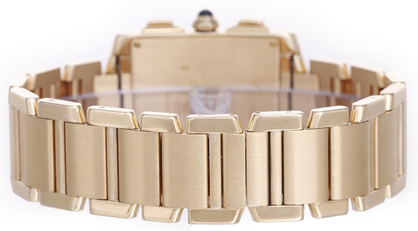 Cartier 18k yellow gold Tank Francaise chronograph wristwatch, Ref. W5000R2, with  quartz movement. 18k yellow gold rectangular case (28mm x 36mm). Ivory-colored dial with black Roman numerals; date, hour minute and seconds recorders. 18k yellow