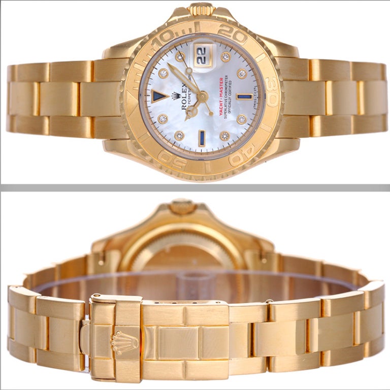Rolex lady's 18k yellow gold Yacht-Master wristwatch, Ref. 69628, with automatic movement, 29 jewels, Quickset date, sapphire crystal. 18k yellow gold case with rotating bezel (29mm diameter). Mother-of-pearl dial with diamond and sapphire hour