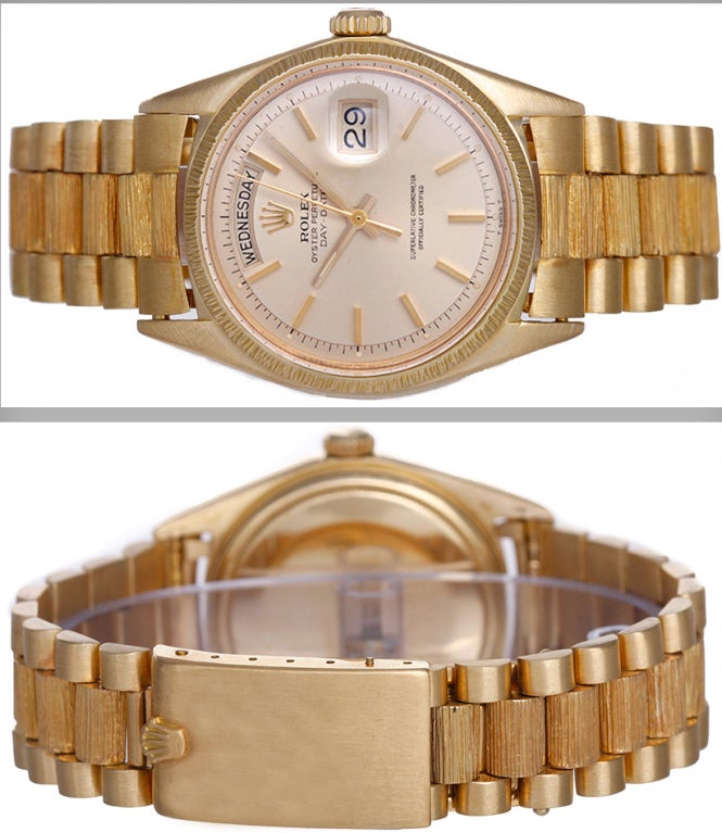 Rolex 18k yellow gold Barked Day-Date President wristwatch, Ref. 1807, with automatic movement, non-quickset date, 26 jewels, acrylic crystal. 18k yellow gold case with barked bezel (36mm diameter). Champagne dial with gold stick markers. 18k yellow