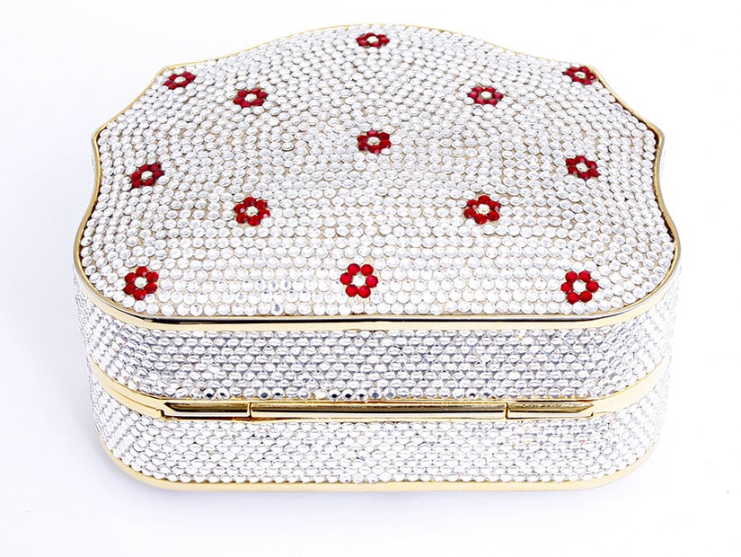 Authentic and New Without Tags Judith Lieber White Crystal with small red flowers clutch or crossbody handbag. This beautiful bag came from Neiman Marcus and is in new condition. It is quite small and measures 4 inches wide, 3.25 inches tall and 2