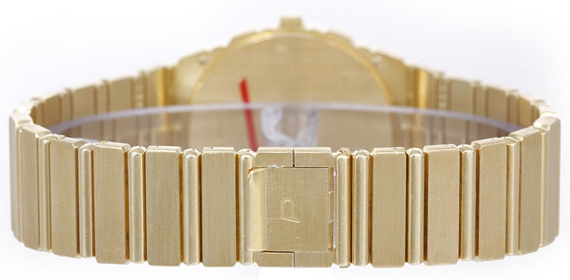 Piaget 18k yellow gold men's Polo dress watch with quartz movement. 18k yellow gold case (31mm diameter). Gold dial with day and date. 18k yellow gold bracelet (will fit apx. 7-in. bracelet). Pre-owned with custom box.