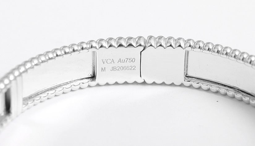 Stunning Authentic White Gold Van Cleef & Arpels Perlee Signature Bracelet, small model. This bracelet is Ref. #VCARN8P700. Playful, modern, and refined...Perlee brings back contemporary jewelry. Each golden pearl protects a wish and carries within