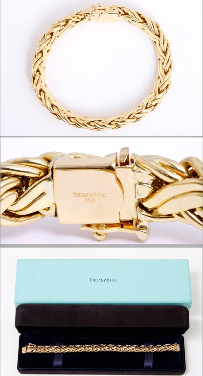 Beautiful Tiffany 18k Yellow Gold Woven Braid Bracelet - . This genuine Tiffany bracelet is a woven braid of 18k yellow gold. It is 7-inches long and has a safety clasp. It is signed Tiffany.  The total weight is 35 grams. This would be beautiful