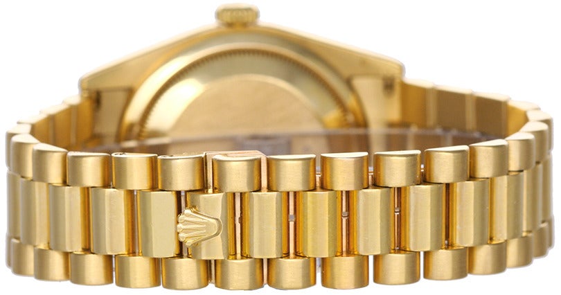 Rolex 18k yellow gold Day-Date President wristwatch, Ref. 118238, with champagne dial and automatic movement, 31 jewels, Quickset date, sapphire crystal. 18k yellow gold case with fluted bezel (36mm diameter). Champagne dial with raised gold baton