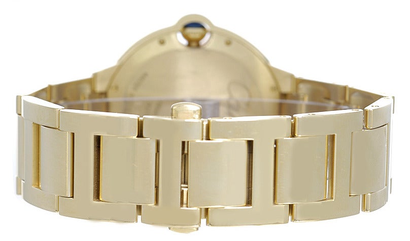 Cartier 18k yellow gold and diamond Ballon Bleu 42mm wristwatch, Ref. WE9007Z3, automatic movement with date. 18k yellow gold case with two rows of factory diamond to the bezel (42mm diameter). Silvered guilloche dial with black Roman numerals. 18k