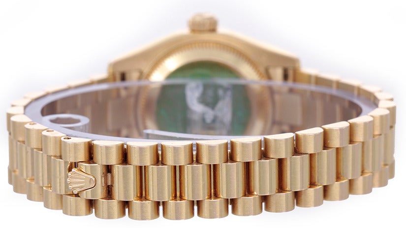 Rolex 18k rose gold case with factory diamond bezel, 26mm diameter, Ref. 179175. Factory meteorite dial with diamond hour markers. 18k rose gold Rolex hidden-clasp President bracelet. Automatic-wind movement, 31 jewels, Quickset date, sapphire