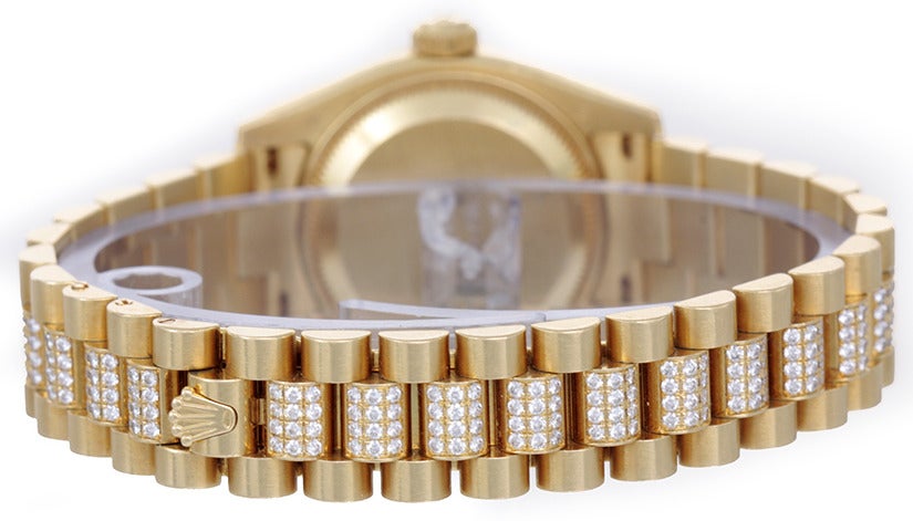 Rolex lady's 18k yellow gold and diamond President wristwatch, Ref. 179158, 18k yellow gold case with factory diamond bezel and lugs, 26mm diameter. Factory black Jubilee diamond dial. 18k yellow gold Rolex President bracelet with diamond center
