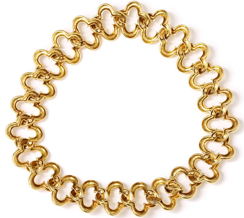 Van Cleef & Arpels 18k Yellow Gold Alhambra Motif Chain Necklace 16-in. 137g  . This beautiful 18k yellow gold necklace features the Alhambra motif in a chain link design. Each clover shaped link is 1-in. x 1-in.  The necklace is 16-in. long and