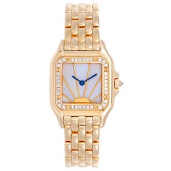 Cartier Lady's Yellow Gold and Diamond Panther wristwatch with Bracelet and Mother-of-Pearl Dial