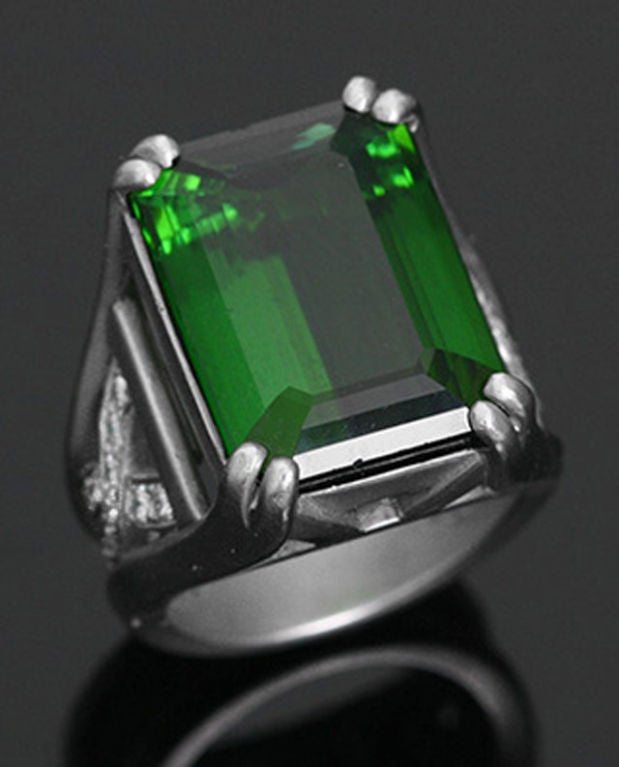 This platinum ring features a large apx. 35 cts. Tourmaline and .33 carats of diamonds. The top of the ring measures 1/2 inch wide and 3/4 inches long. It weighs 25.2 grams and the ring size is 6. This stunning ring is stamped 1998, moon and star