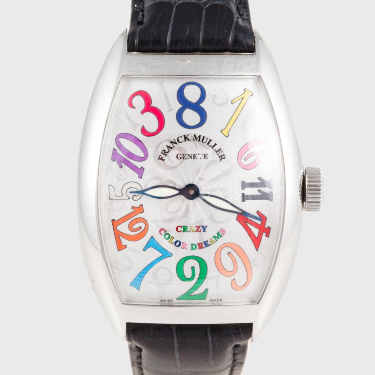This Franck Muller Crazy Color Dreams wristwatch features a fun movement with an hour hand that hops around to the correct number. The case is stainless steel. This limited edition is model 8880CH, No. 94. The original box is included.