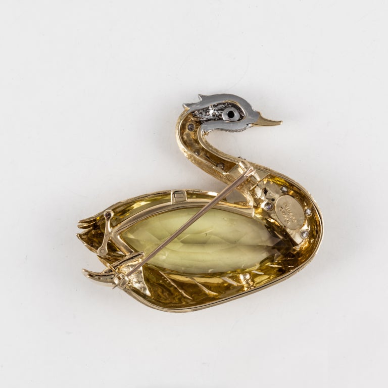 E. Wolfe & Co. swan brooch composed of 18K yellow gold featuring a large faceted citrine accented by 1.10 carats of diamonds, and a round onyx stone as the eye of the swan.