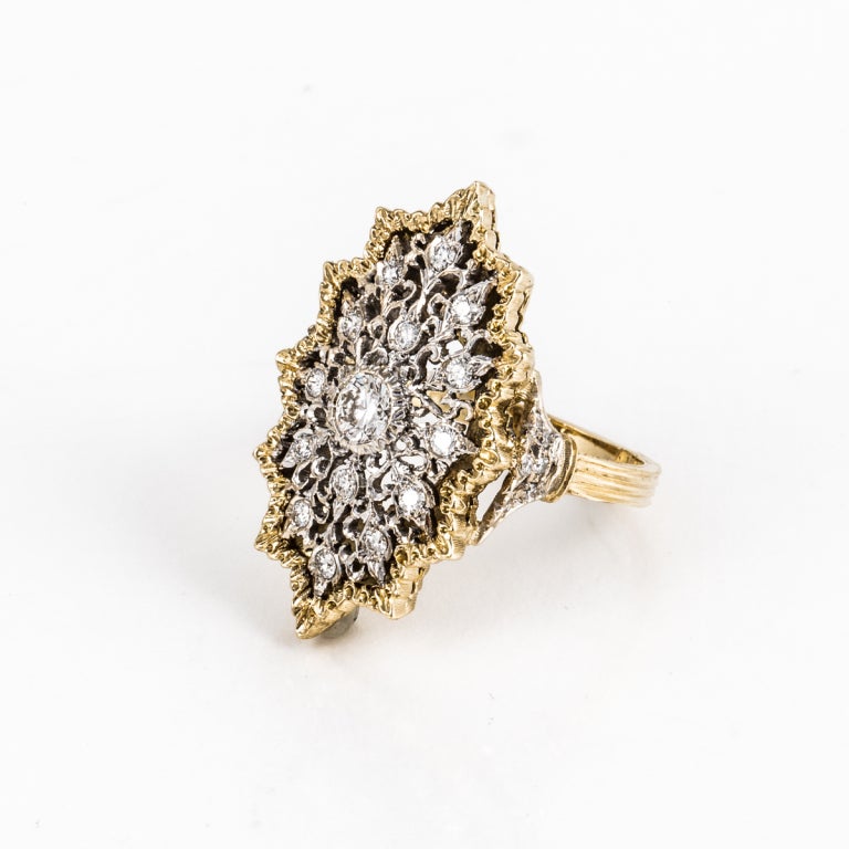 This intricate Buccellati ring is a mix of 18k yellow gold and 18k white gold. The diamonds weigh 0.95 carats total weight, and the ring is a finger size 7.