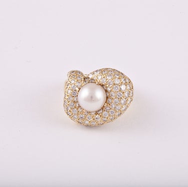 Jose Hess ring composed of 18k yellow gold with pavé set round diamonds featuring a cultured pearl.  The diamonds total approximately 5.00 carats.  The cultured pearl measures 9.5 mm. The ring is currently a size 6.