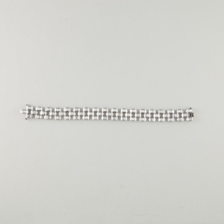Bracelet with three-rows of baguette diamonds in platinum.  Diamonds total 19.20 carats, F-G color and VVS1-VS1 clarity.  It measures 7 inches in length.