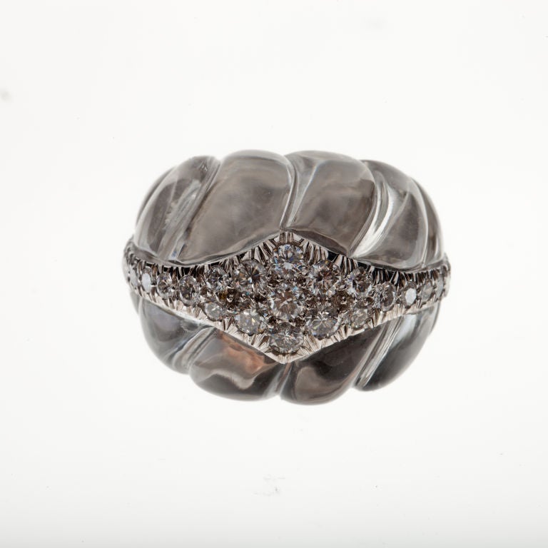 David Webb domed ring composed of 18K white gold and platinum with carved rock crystal accented by 31 round brilliant-cut diamonds.  The diamonds total 1.20 carats, F-G color and VVS2-VS1 clarity.  It is signed 