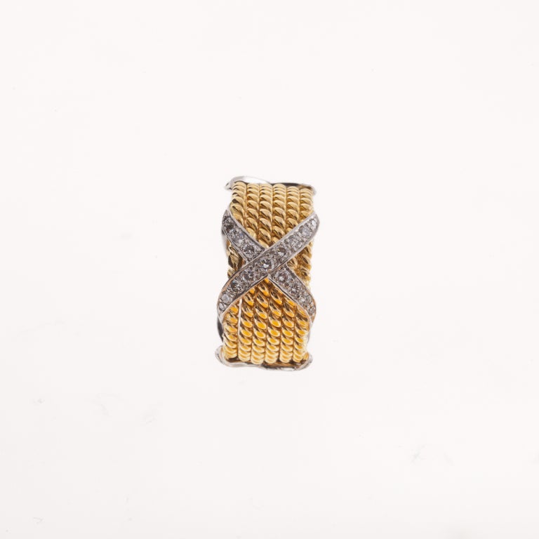 TIFFANY & CO. SCHLUMBERGER 18KT yellow gold, with 6 rows, platinum and diamond 'X' wedding band.
Signed - Tiffany & Co. Schlumberger 18KT
Size 6.5