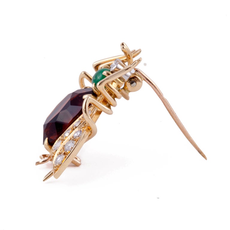 VAN CLEEF and ARPELS 18KT yellow gold, diamond, cabochon emerald and citrine fly pin.  French Hallmarks.

Signed:  VAN CLEEF & ARPELS