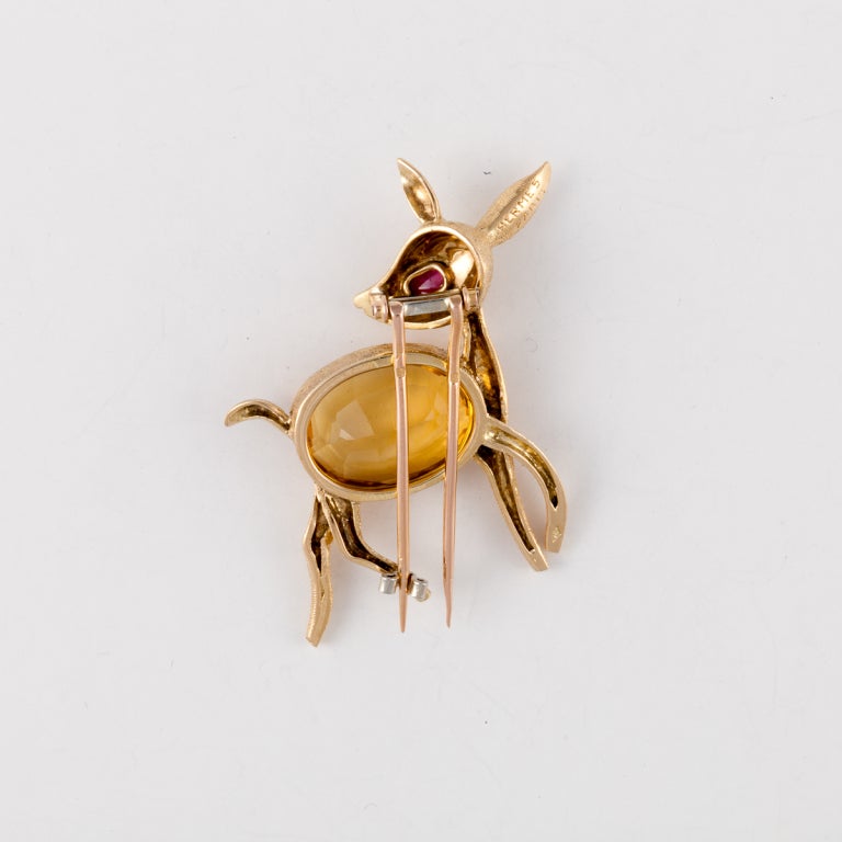 HERMES Charming 18KT yellow gold pin fashioned as a deer with citrine body.
Signed:  HERMES Paris w/ French Hallmarks