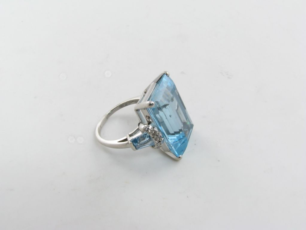 A fabulous emerald cut aquamarine and diamond ring. 1