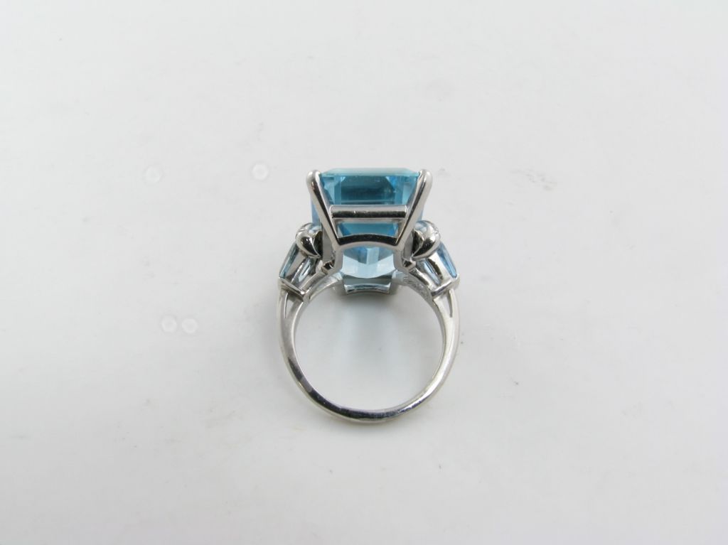 A fabulous emerald cut aquamarine and diamond ring. 2