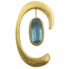 H. BURLE MARX yellow gold and aquamarine "C" shape brooch.
