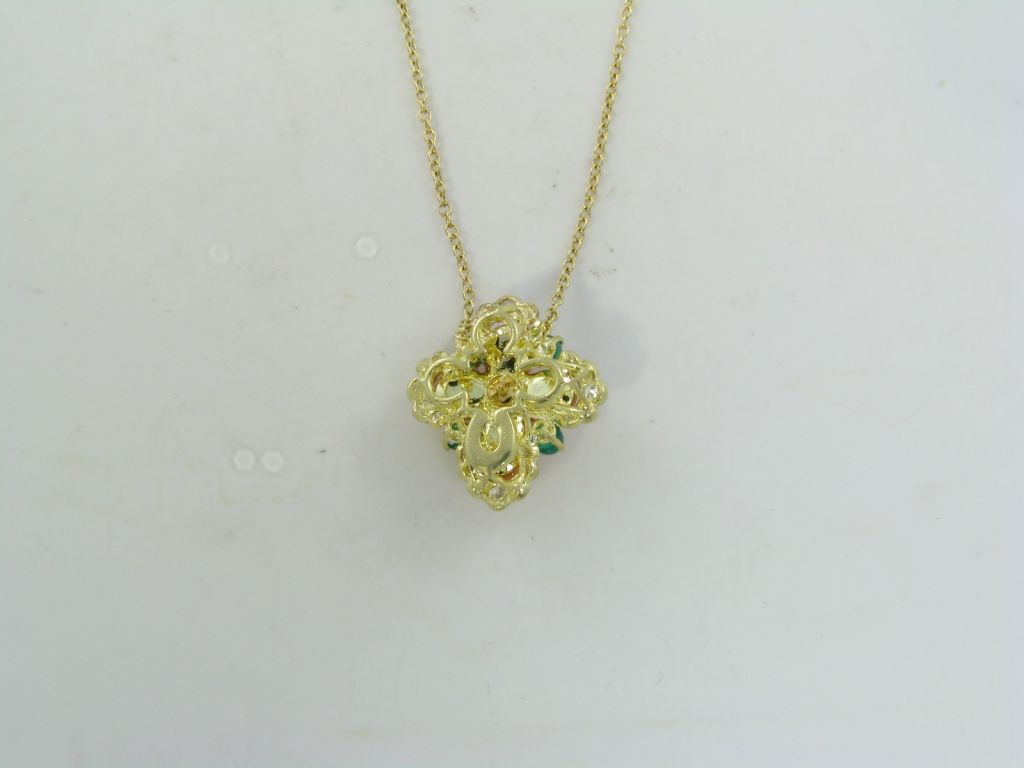 Women's VAN CLEEF & ARPELS coral, diamond, emerald and gold pendant.