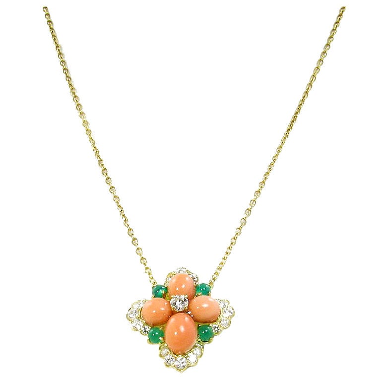 VAN CLEEF & ARPELS coral, diamond, emerald and gold pendant.