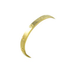 ALDO CIPULLO, CARTIER Yellow Gold "Love" Bangle Bracelet.