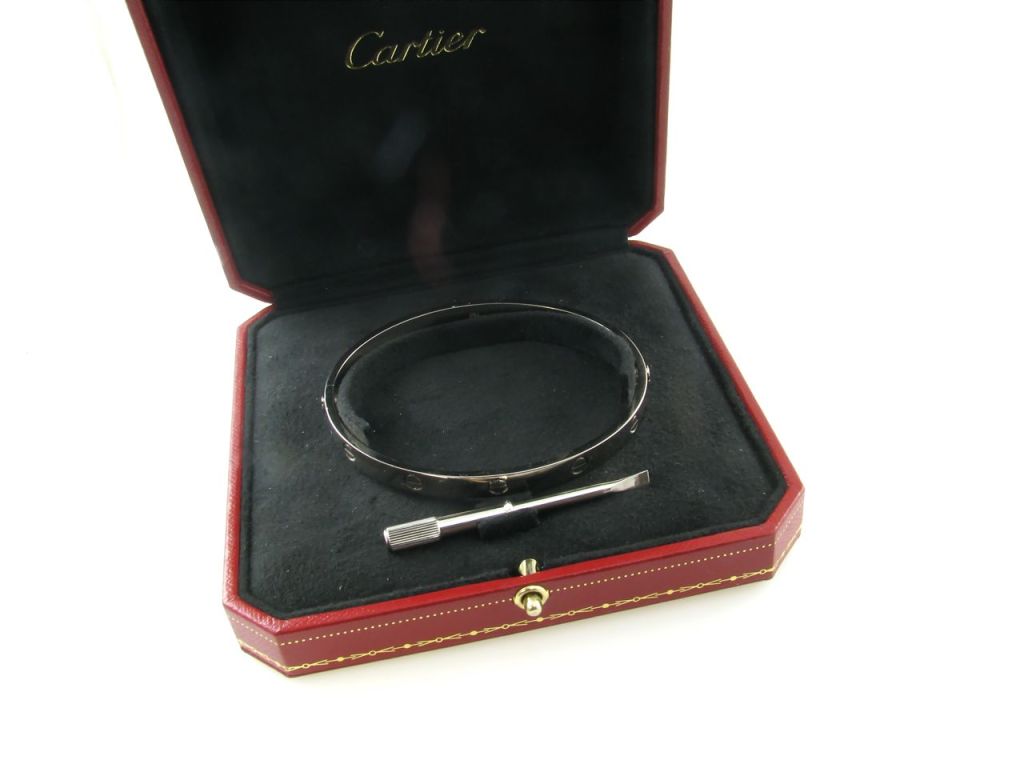 A Cartier 18 karat white gold “Love” bangle bracelet.  Signed 21 750 Cartier © EP5119.  The bracelet is a size 21.  The bracelet has a gross weight of approximately 42.1 grams and measures 8 1/4 inches in circumference.  The bracelet has a white