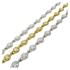 DAVID MORRIS Diamond, Fancy Diamond and Gold Bracelet Suite.