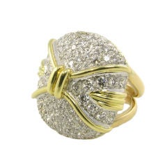 A yellow gold and pave set diamond ring